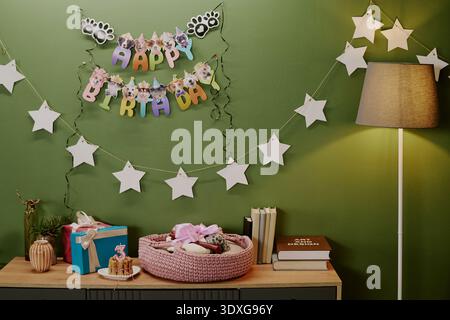 Birthday Party Decor Featuring Gift Boxes and Cake with Number Three Candle Stock Photo