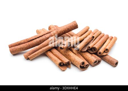 Cinnamon sticks pile on white background. Stock Photo