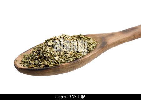 Oregano dried leaves on wooden spoon, isolated on white background. Stock Photo