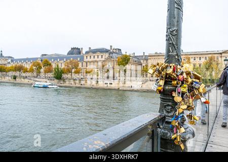 Love Locks on Lamppost by Seine River bribde, Paris, France - October 29, 2025 Stock Photo