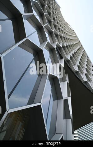 Singapore, 23 Dec 2017: Exterior of DUO Tower in Singapore featuring its iconic hexagonal honeycomb facade designed by Ole Scheeren. Modern architectu Stock Photo