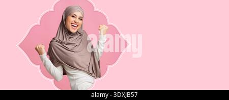 Happy Woman Celebrating With Joyful Expression in Bright Colored Background Stock Photo