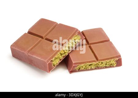 Two pieces of dubai chocolate filled isolated on white background. chunks of pistchio filled dessert Stock Photo