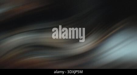 A blurry and dark abstract image featuring shades of gray and white with hints of green and blue light Stock Photo