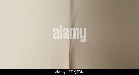 Abstract image showing a vertical crease dividing a beige and brown gradient background evenly split Stock Photo