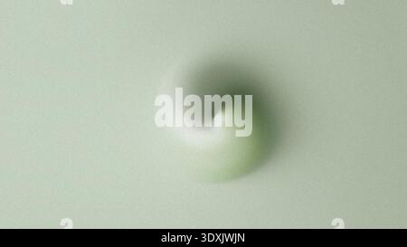 A blurry and out of focus close up image showcasing a light green and white circular shape on a plain background Stock Photo