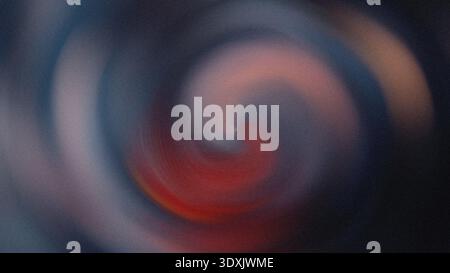 A blurred abstract image featuring swirling patterns of red white and dark blue creating a dynamic effect Stock Photo