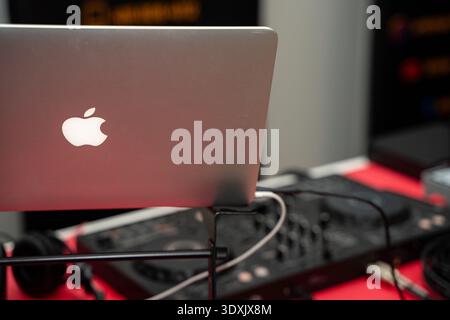 Rear view of Apple MacBook laptop on DJ stand. Toronto, Canada - February 27, 2026. Stock Photo