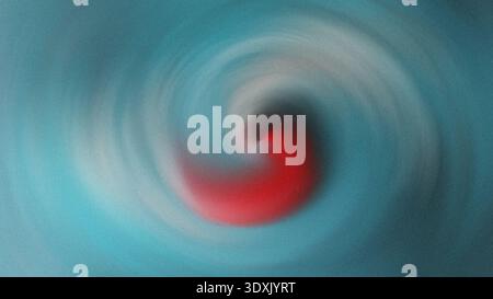 Abstract blurred spiral with red center and teal edges creating a swirling motion effect in the image art Stock Photo