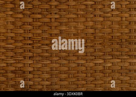 Texture of woven wicker basket surface, natural handmade material background. Stock Photo