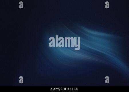 A blurry abstract image featuring shades of blue and dark colors creating a mysterious atmosphere and depth Stock Photo
