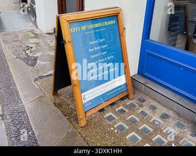 London, UK - February 01, 2026: Exterior blue City London Cigars storefront sign showing cigars and tobacco options outside a London shop. Stock Photo