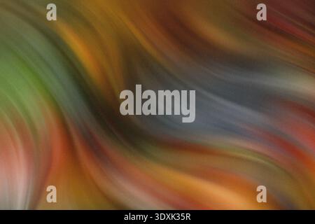 Abstract blurred background featuring a mix of vibrant colors blending together seamlessly in a soft manner Stock Photo