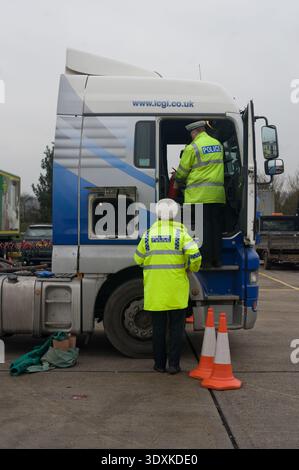 Police officers conduct safety inspections at the roll-on/roll-off ...