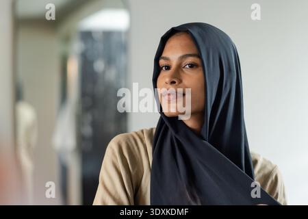 Student mid20s sitting in study explaining Fourier cosine series on whiteboard computing sum 1 or n^ Stock Photo