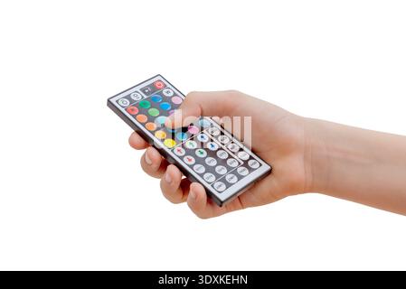 Hand holding RGB LED light remote control for adjusting colors and brightness isolated on white background Stock Photo