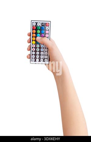 Hand holding RGB LED light remote control isolated on white background used for adjusting colors and lighting modes Stock Photo