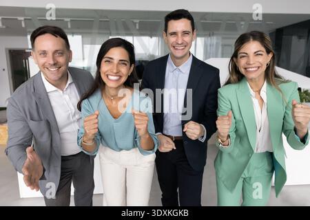 Friendly diverse professionals posing for informal group portrait in office Stock Photo