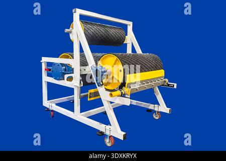 A cable windingunwinding machine, featuring two textured cylindrical rollers one large at top, one small at bottom on white supports with blue element Stock Photo