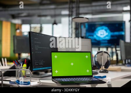 Isolated screen laptop running advanced AI algorithms in empty startup workspace. Artificial intelligence coding platform used to deploy deep learning models on mockup notebook Stock Photo