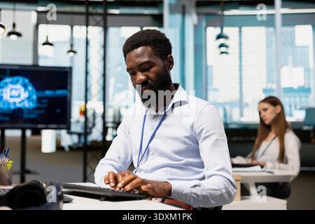 Software developer adjusting deep learning algorithms parameters at work to automate tasks. IT specialist in technology company working with AI driven insights for code optimization Stock Photo