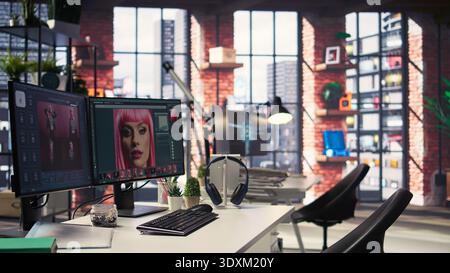 Organized creative workspace for graphic designers and photographers, featuring a dual monitor setup with digital editing tools. Photo editor software and AI chat bot for content creation. Stock Photo