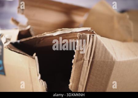 Cardboard box opened and damaged on a table Stock Photo