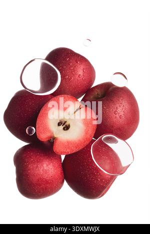 Fresh Red Apples with Water Splashes and Floating Droplets on White Background Stock Photo