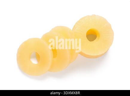 Canned pineapple rings on white background Stock Photo