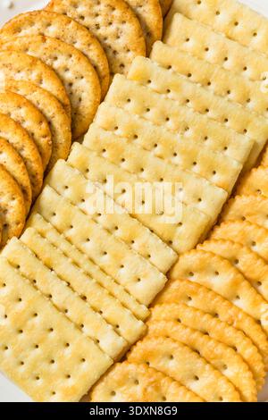 Salty and Buttery Cracker Assortment on a Plate with Sea Salt Stock Photo