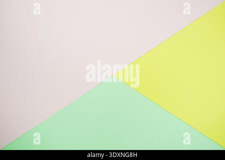 A minimal abstract image featuring intersecting geometric triangles in soft pastel color Stock Photo