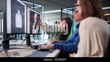 Engineers In The Lab Designing An Autonomous AI Robot Prototype. Stock Photo