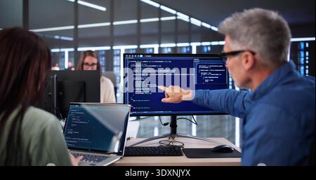 Secure Cyber Business Code Training With Developers In Office Environment Stock Photo
