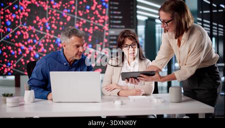 Big Data Center: AI Engineer And Technician Researching Computer System Stock Photo