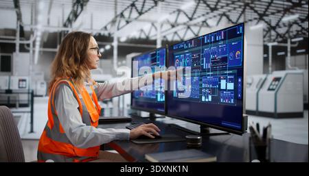 Skilled Woman Operates Modern Factory Machine With Efficiency And Precision. Stock Photo