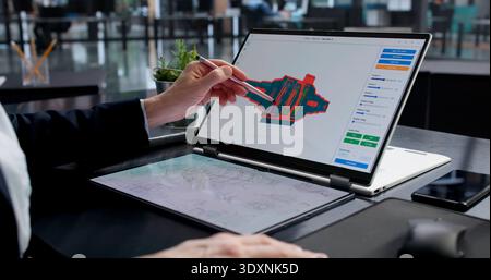 Female Engineer Developing 3D CAD Model Of Laptop Screen Stock Photo