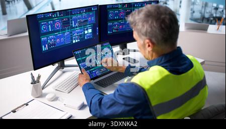 Skilled Engineer Monitoring Power Plant With Advanced SCADA System Stock Photo