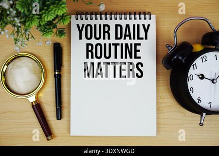 Keep Going And Growing text written on notepad with alarm clock and magnifying glass flat lay on wooden background Stock Photo