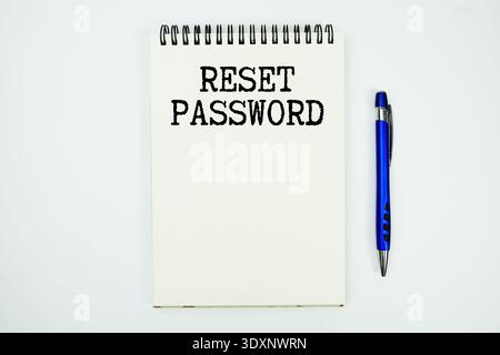 Reset Password message written on notepad with pen on white background Stock Photo