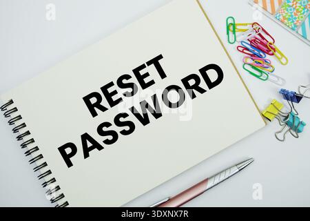 Reset Password text message written on notepad with stationery flat lay on white background Stock Photo