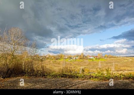 A small village in autumn on the other side of the river, Russia Stock Photo