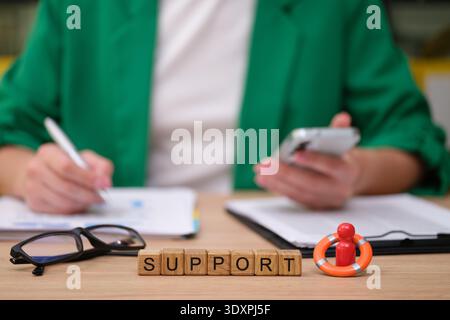 Creative work session focused on support with tools and notes in a vibrant, engaging environment Stock Photo