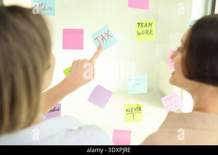 Creative brainstorming session engages team members in lively discussion and collaboration about business strategies and task priorities Stock Photo