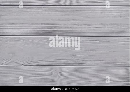Gray painted wooden planks creating a rustic background texture, ideal for design projects and adding a touch of natural charm Stock Photo