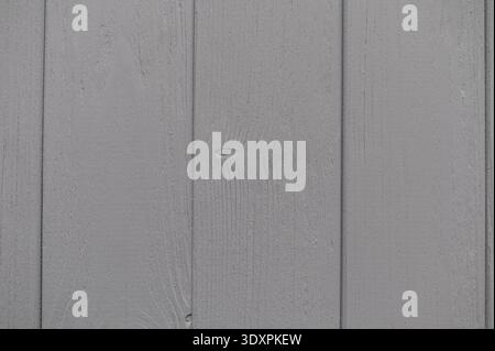 Gray painted wooden planks creating a rustic background texture, ideal for design projects and adding a charm of natural touch Stock Photo