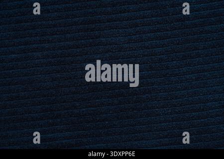 Dark navy ribbed fabric texture background, close up textile surface with copy space Stock Photo