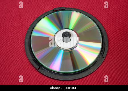 A case-style holder for blank CDs on red background Stock Photo