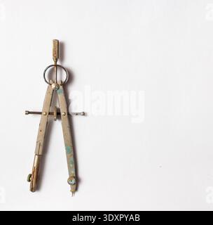 Elegant vintage brass compass on a clean white background, perfect for design and drafting projects Stock Photo