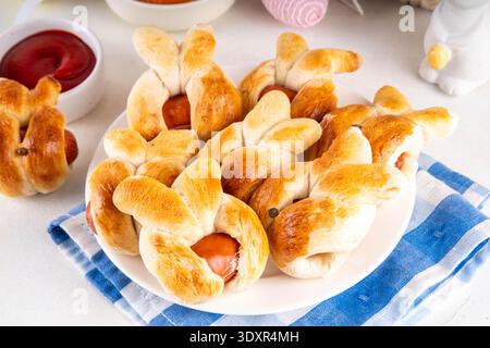 Easter Bunny Sausage Bread Rolls, Tasty Hot Dog buns in for of bunny faces, creative made food for Easter holiday party or brunch Stock Photo