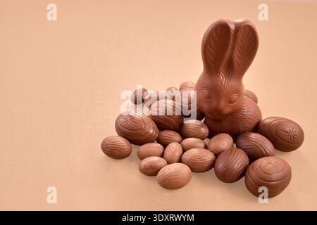 Chocolate easter bunny with sweet festive eggs Stock Photo